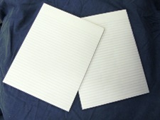 standard paper pad, ruled white, no branding